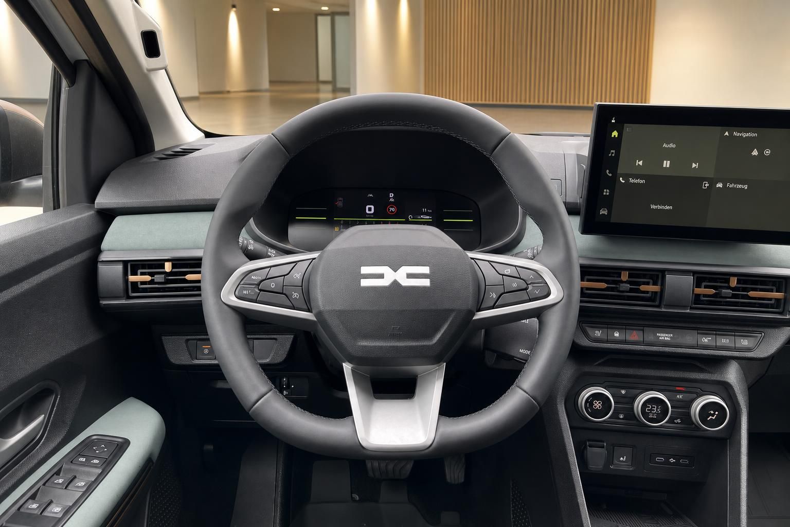 Modernes Fahrzeug-Cockpit mit Lenkrad, digitalem Display und Infotainment-System