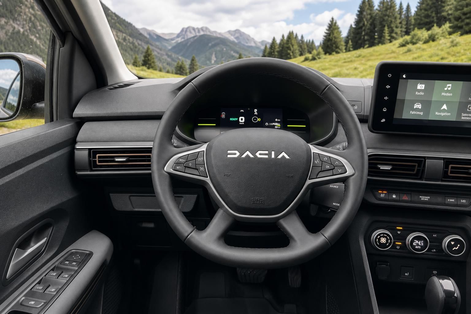 Dacia Armaturenbrett mit Lenkrad, Tacho und Touchscreen vor Berglandschaft