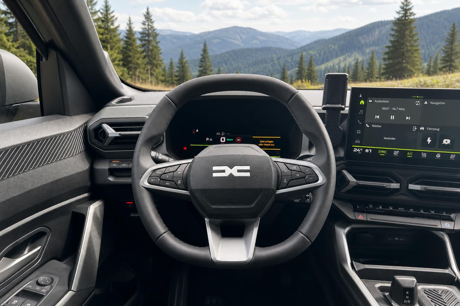 Modernes Fahrzeug-Cockpit mit digitalem Display und Lenkrad in bergiger Landschaft
