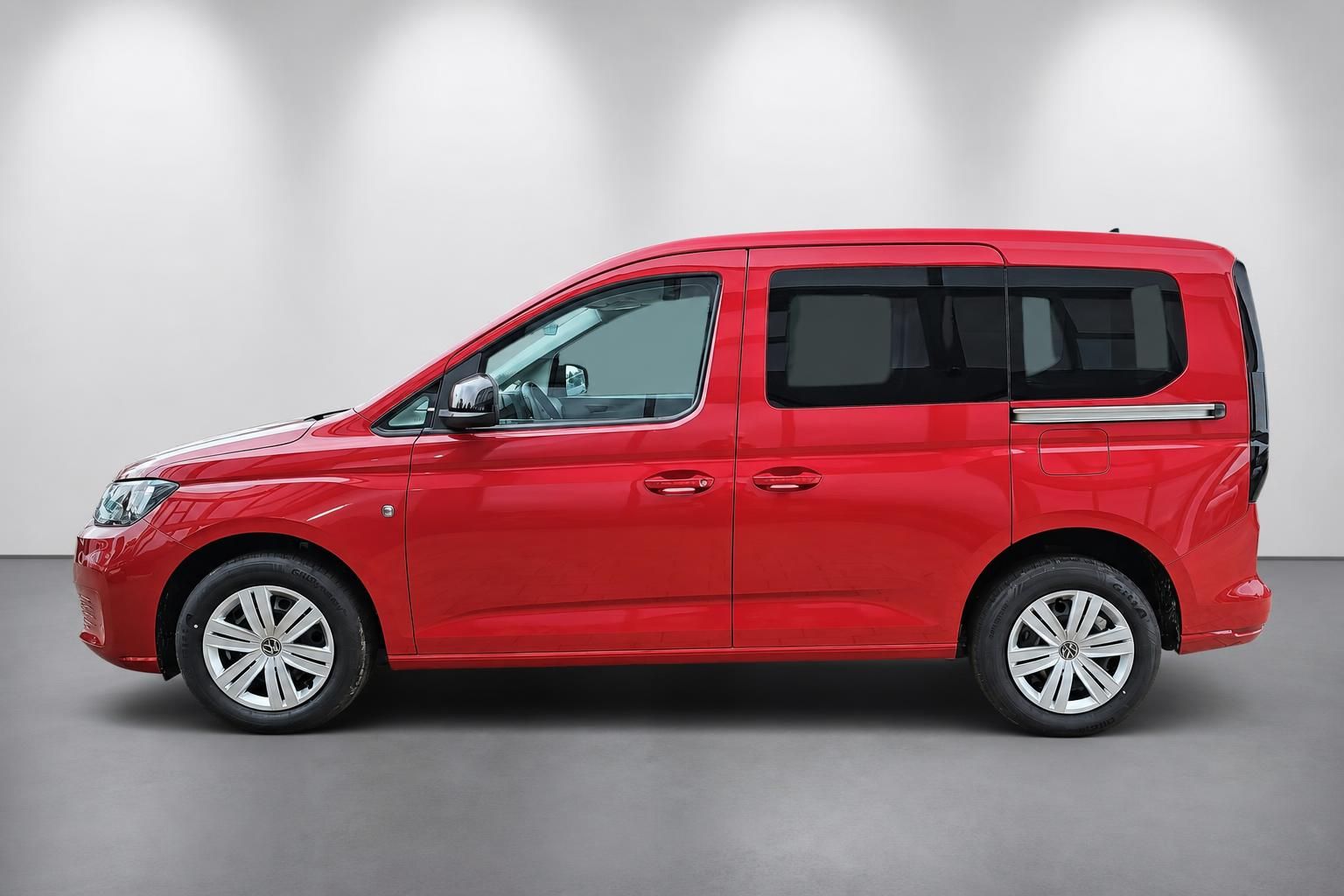 VW Caddy rot Seitenansicht Neuwagen Studiofoto
