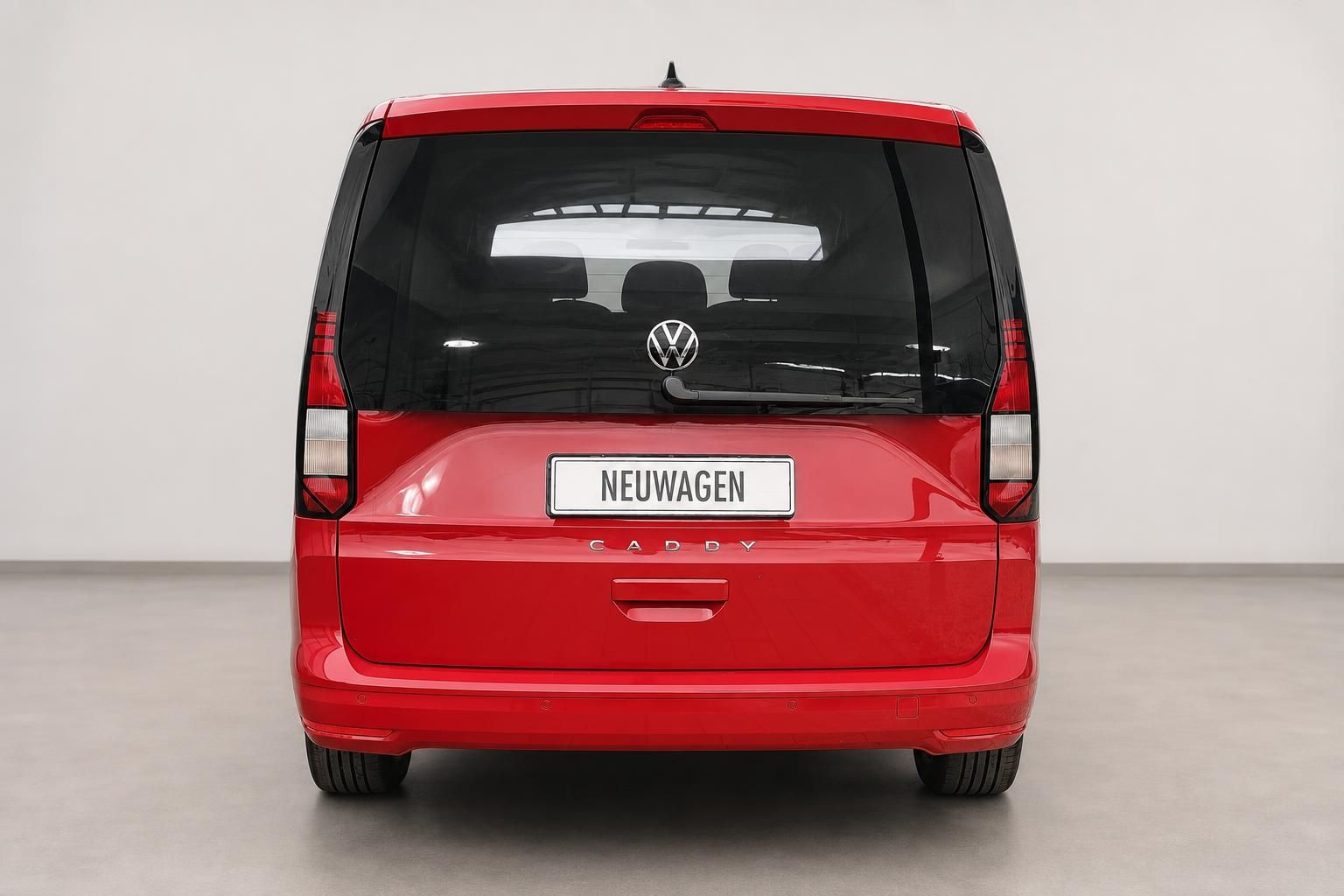 VW Caddy in Rot, Heckansicht mit Rückleuchten und Kofferraumklappe