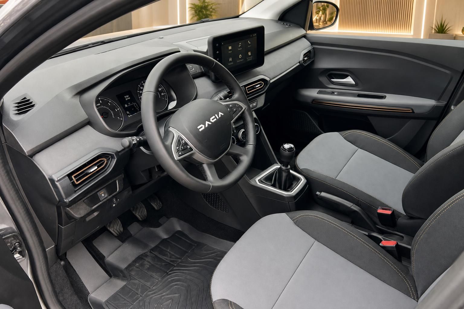 Dacia Jogger Innenraum schwarz-grau mit Lenkrad, Armaturenbrett und Touchscreen