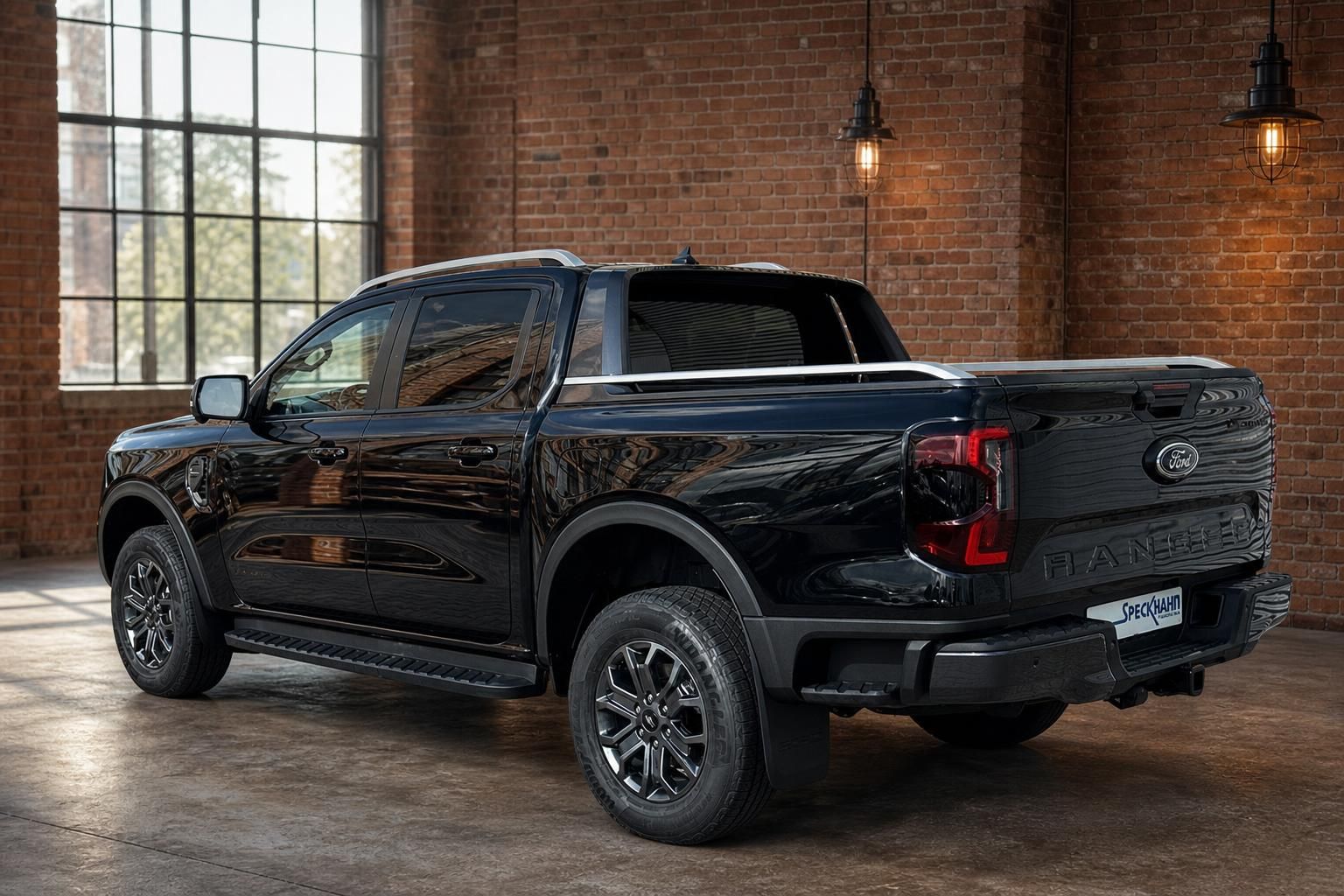 Ford Ranger schwarz Pickup Heck-Seitenansicht vor Backsteinwand