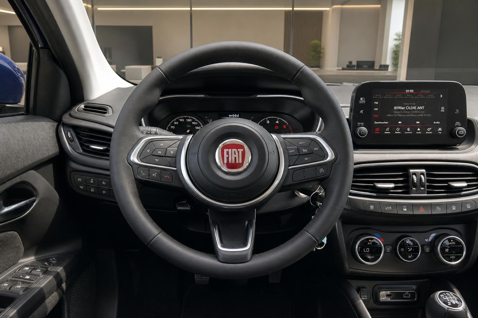 Fiat Innenraum Cockpit mit Lenkrad, Tacho und Touchscreen-Infotainmentsystem
